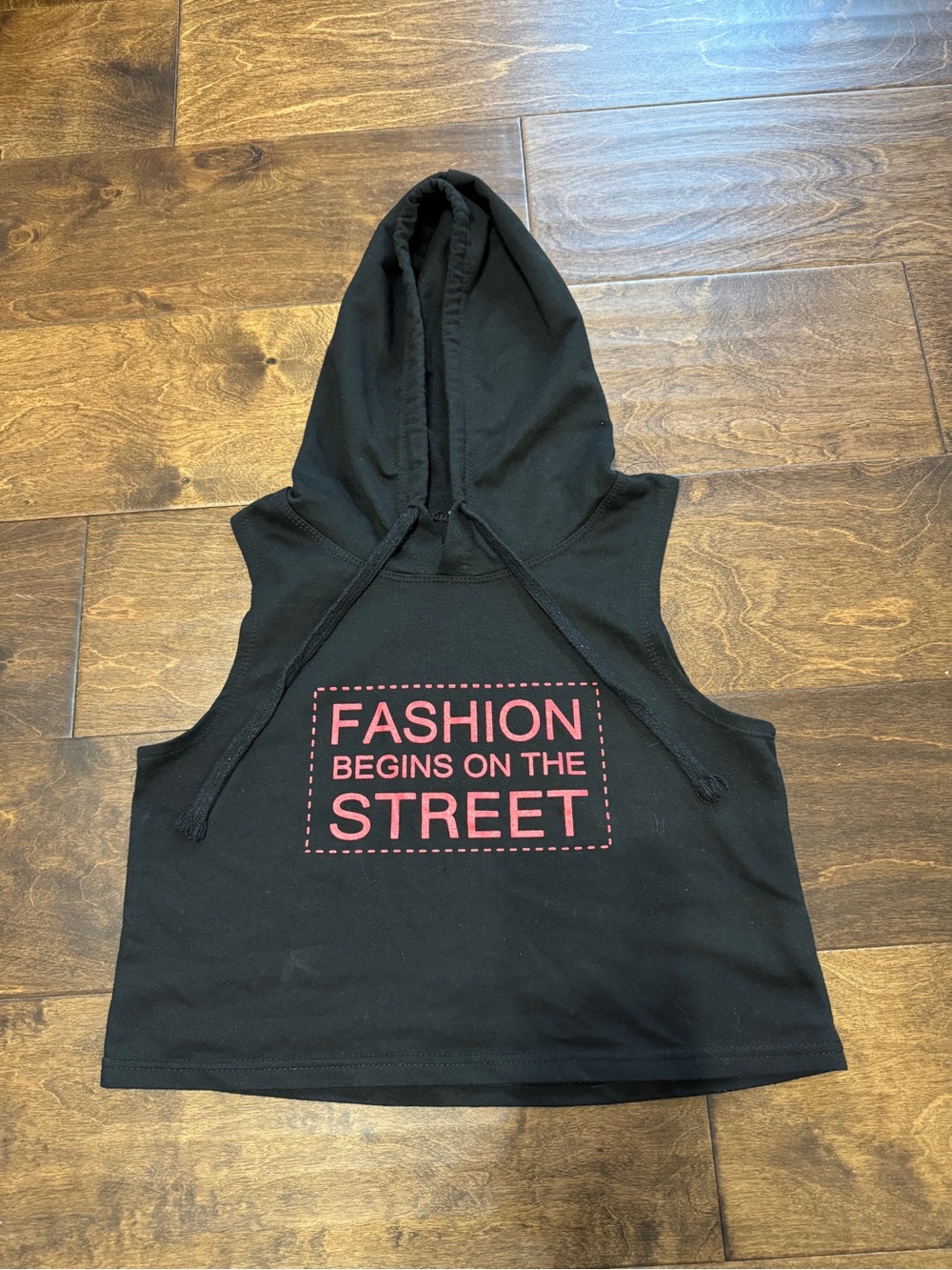 Black Sleeveless Hoodie Crop Top with Pink 'Fashion Begins on the Street' Print